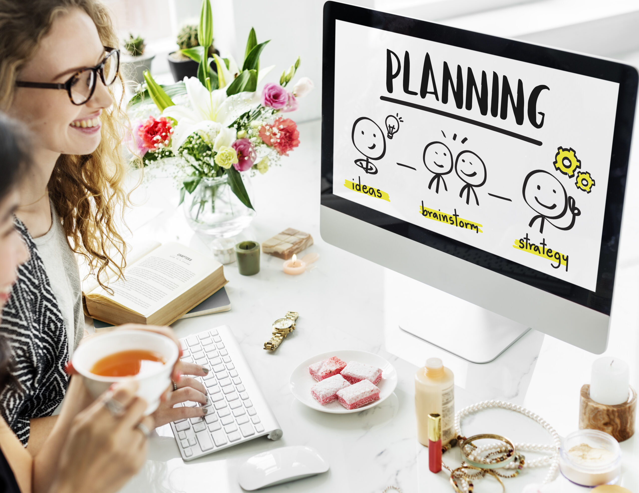 A lightbulb and gears representing ideas, process, and strategy