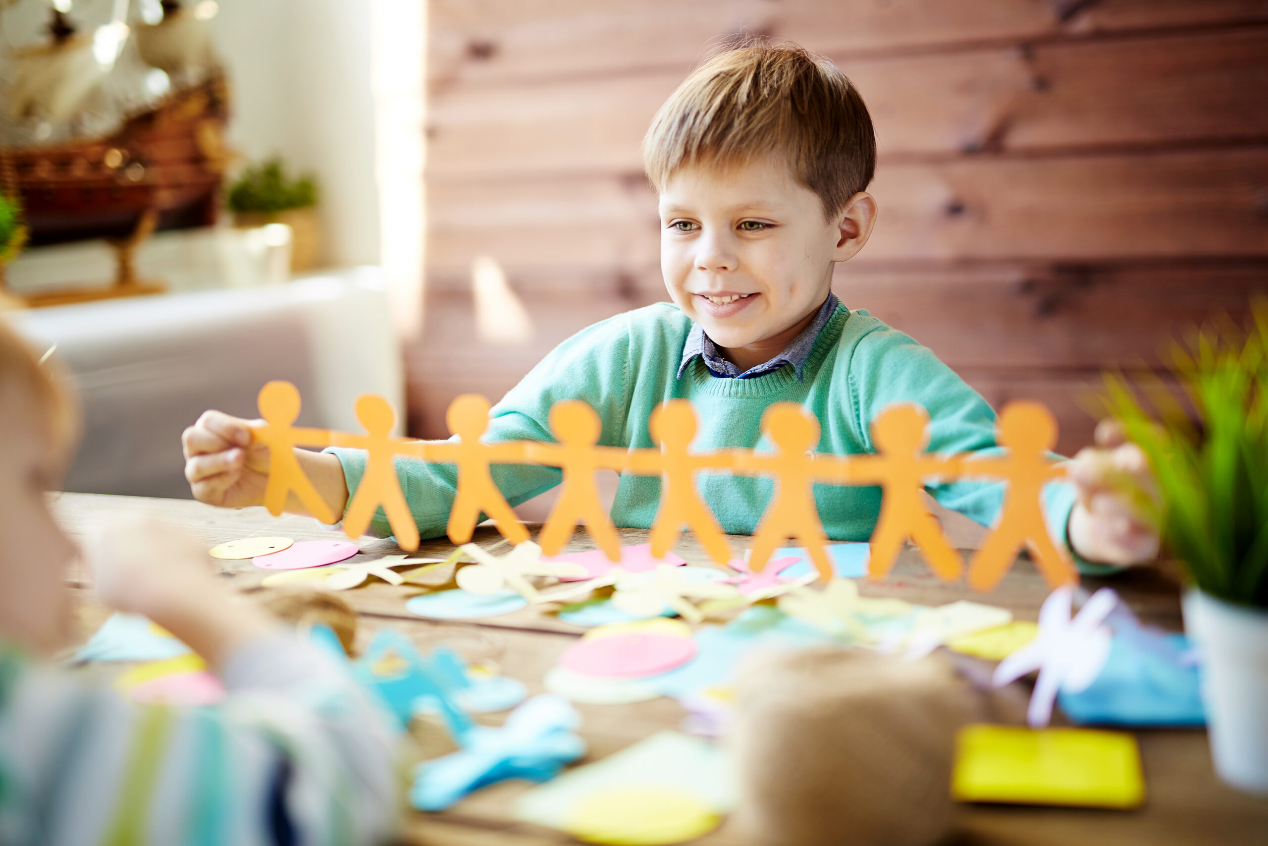A group of kids doing papercraft together