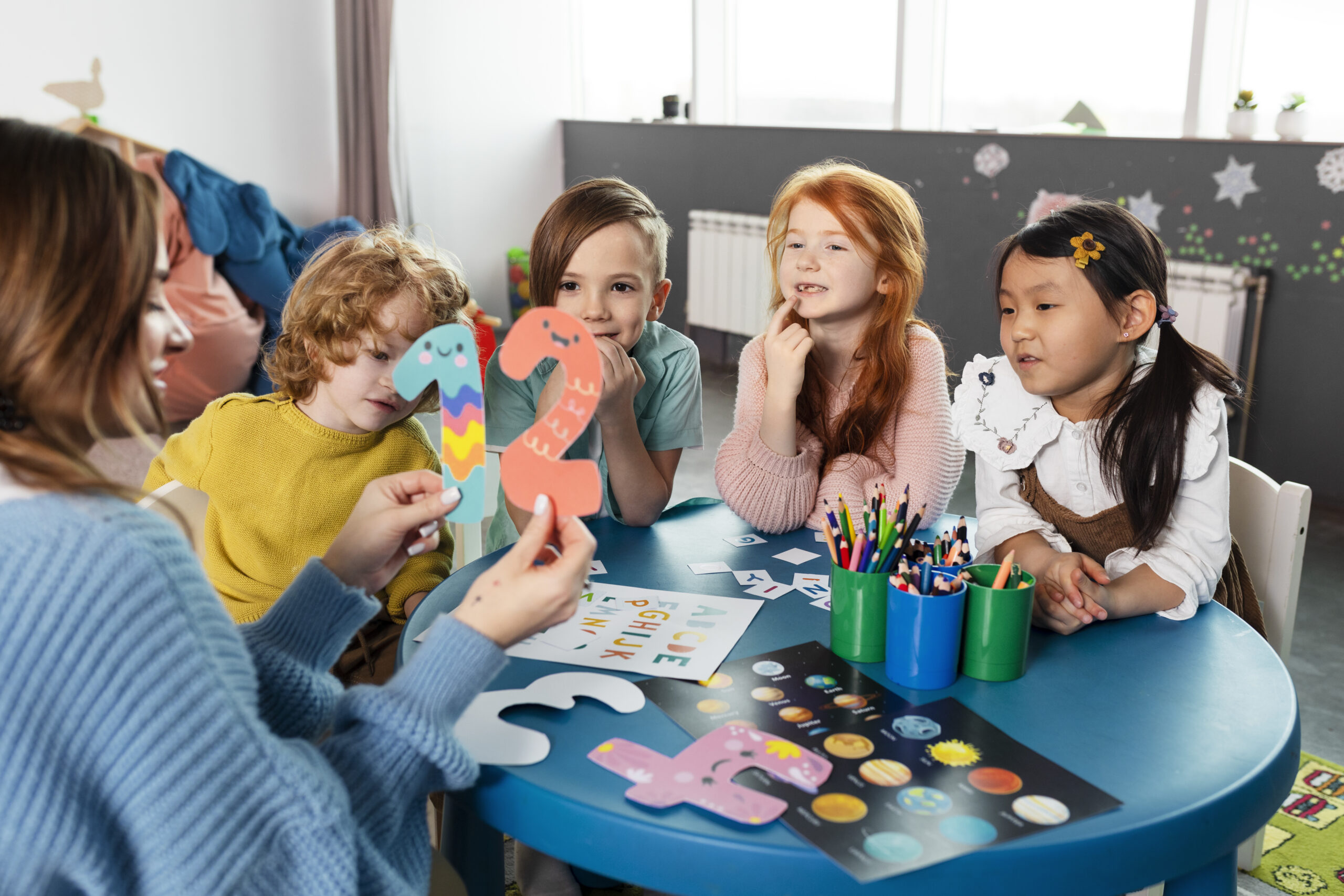 Children sitting together at a table for a group activity