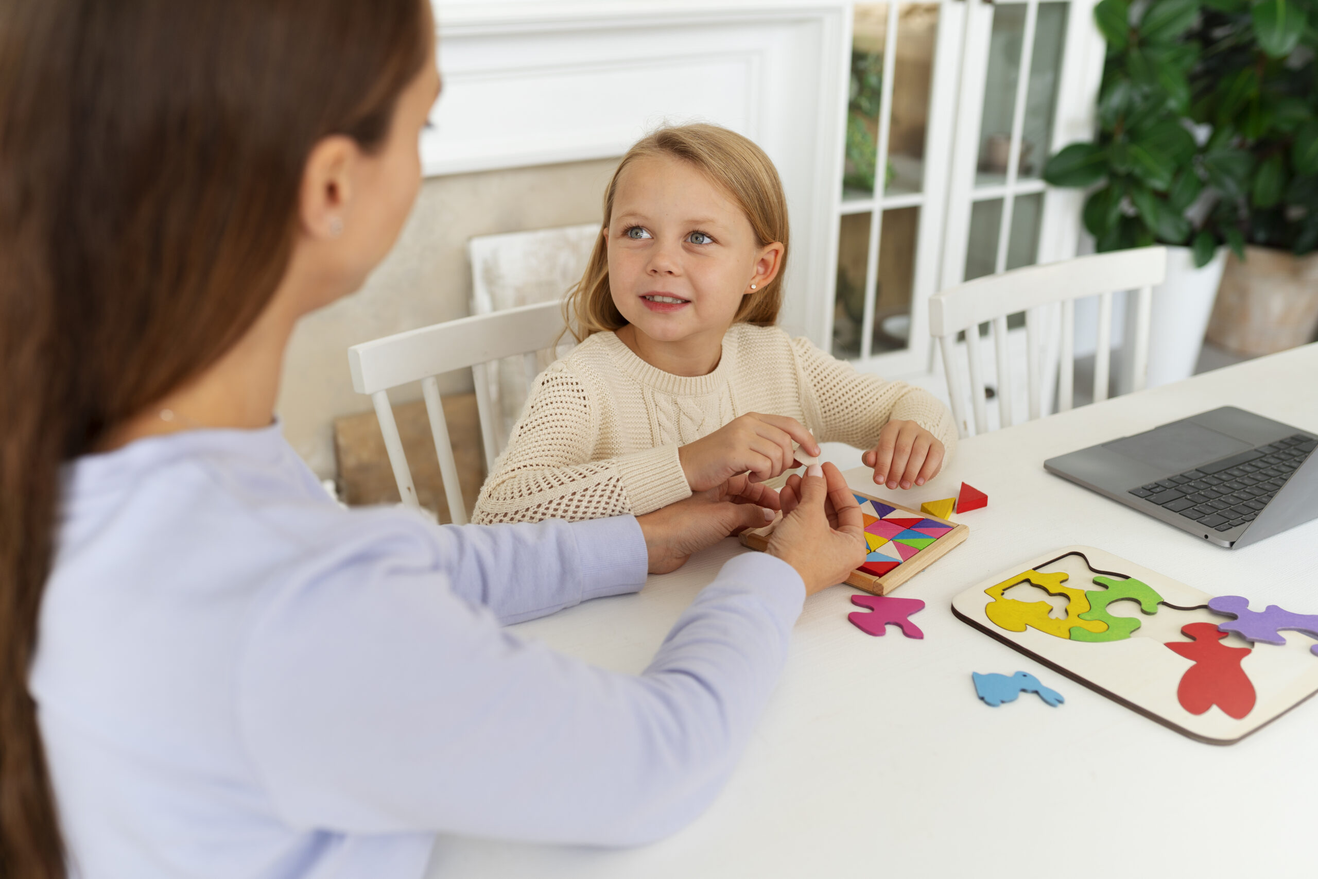 Therapist and family during an in-home consultation.