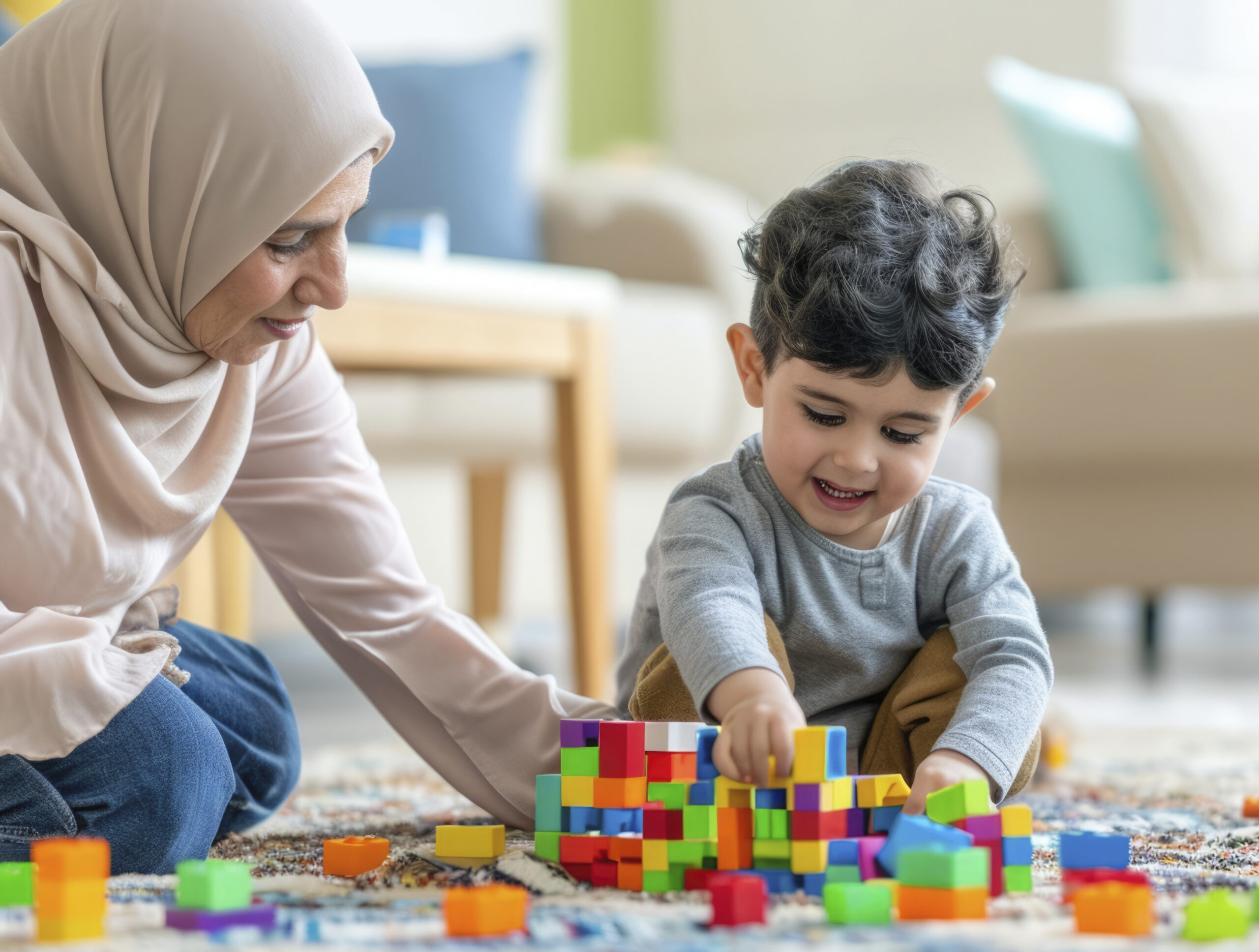 A young child with autism playing with their family.