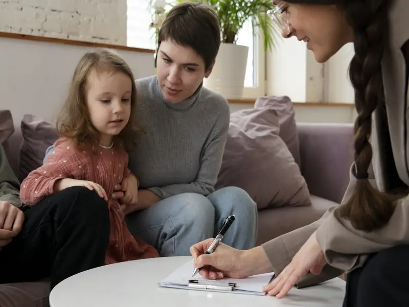 Parent and child talking to a psychologist